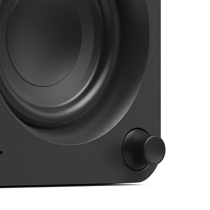 Активни тонколони Kanto Audio ORA в черен цвят, детайл на копчето за сила на звука и уофъра